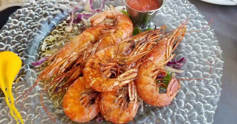 Grilled shrimp on sliced cabbage